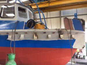 Exterior of the MV Ross Point showing plate repairs to bow forward and mooring post