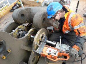 Engineer from Hickman Engineering working on line boring some construction equipment