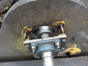 Machine boring a hole through a steel brace