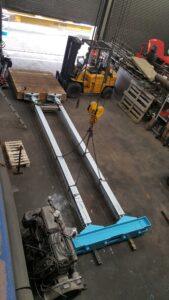 Large steel girder in light blue and frame fabricated by Hickman Engineering