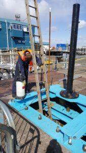 Engineer holding a ladder at the dock side in Grimsby