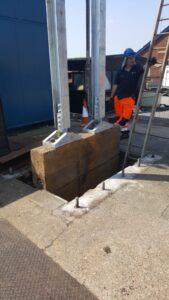 Engineer stood underneath a crane near the support braces