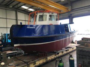 side view of a ABP Progress boat in for repair and re-painting with Hickman Engineering
