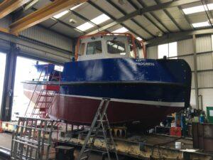 side view of a ABP Progress boat in for repair and re-painting with Hickman Engineering