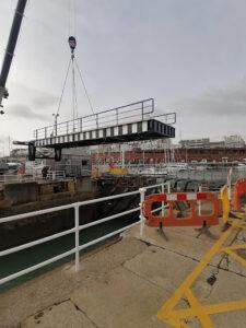Road access bridge being lifted back into place by Hickman Engineering