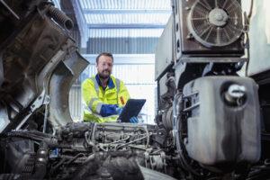 An engineer ticking off a checklist for urgent shipping repairs