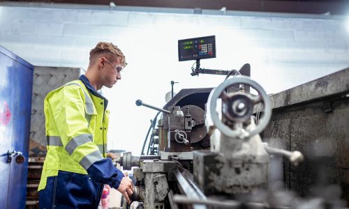 Max Burton from Hickman Engineering on a lathe - Machining Services
