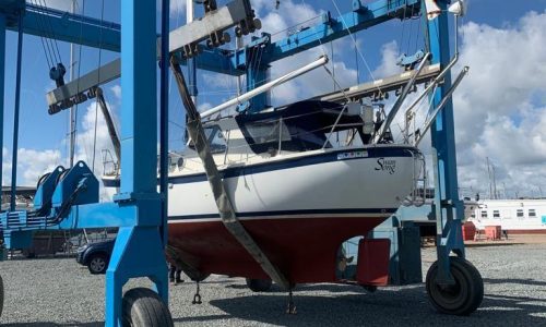 Swan Song Boat Repairs showing boat on a rig ready to be moved