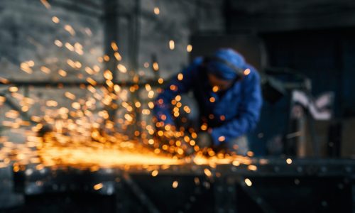 Engineer cutting metals with thermal lancing machine